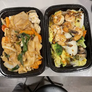 Seafood Drunken Noodle and Goong Garlic Shrimp. There is SOME seasoning/flavor but these are SWIMMING IN WATER FROM FROZEN VEGGIES!! Yuck.