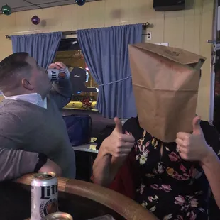 a man with a paper bag on his head