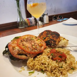 a plate of food and a glass of wine