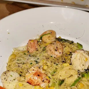 Pasta of Angels featured center and pan seared white fish background.