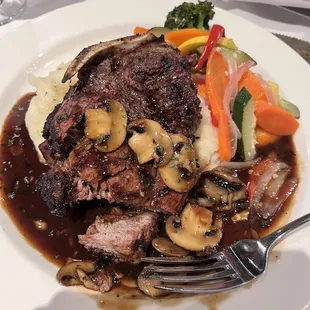 a plate of food with meat and vegetables