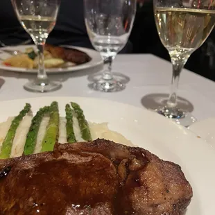New York steak with whipped mashed potatoes and grilled asparagus