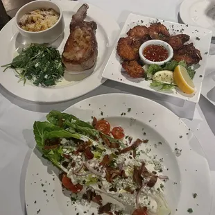 Wedge salad, coconut shrimp, pork chop