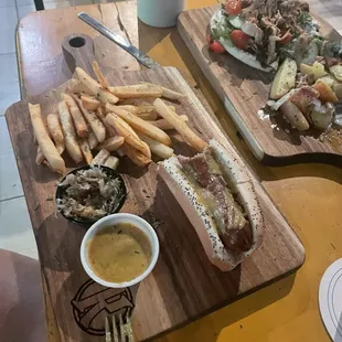 Bratwurst with sauerkraut and fries. Nice crunch to the brat and tartness to the kraut.