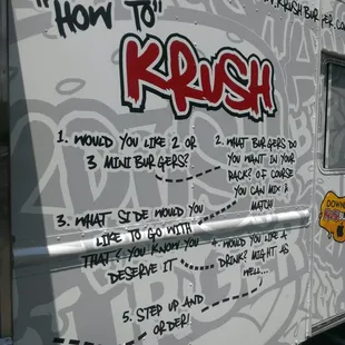 a food truck with writing on the side