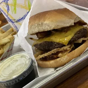 a tray of fries and a cheeseburger
