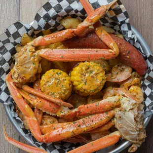  bowl of crab legs and corn