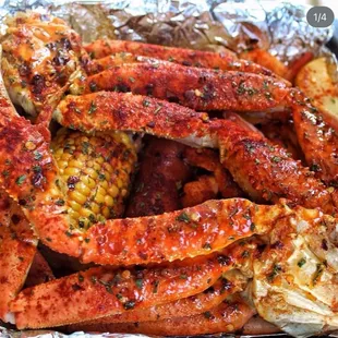 Crab legs and corn, seasoned to perfection