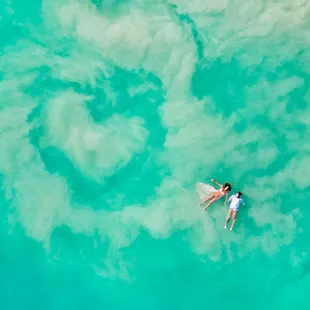 Mother Nature showing off! This maternity session got an amazing surprise when this heart formed in the waves