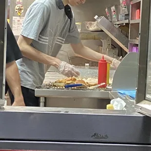 a man preparing food in a kitchen