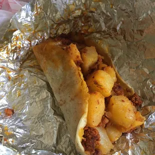 Papas con chorizo taco on flour tortilla
