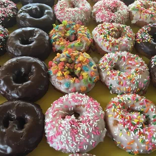 Devil's food, cherry, sprinkles, and fruity pebbles donut