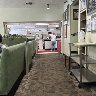 Cute place notice the sign booths order at the counter and pay when served.