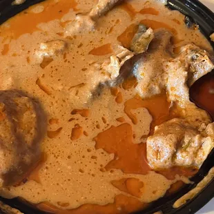 a bowl of stew with meat and vegetables