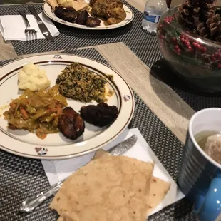 Roti, spinach stew, cabbage stew, fufu, plantains, kanklo plantain fritters