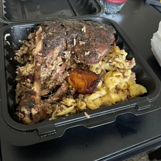 Jerk chicken with rice and peas, plantain, curry cabbage, Mac and cheese