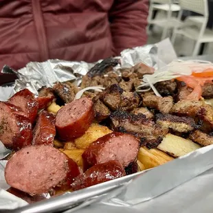 a tray of meat and vegetables