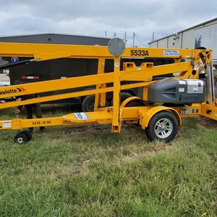 a small yellow work truck