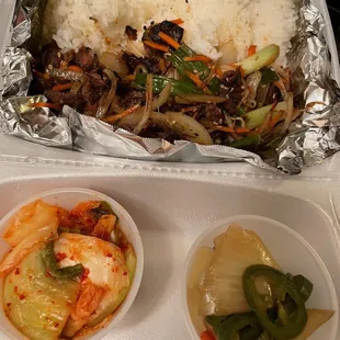 a tray of rice and vegetables