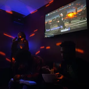 a group of people in a dark room