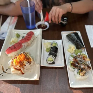 assortment of sushiiii (salmon hand roll, shrimp tempura roll, volcano scallops &amp; I forgot the last one)