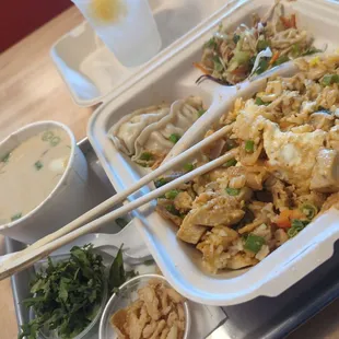 Lunch box- chicken with choice Thai curry sauce, 2 dumplings, Asian slaw. Pretty good! Also to left small coconut soup