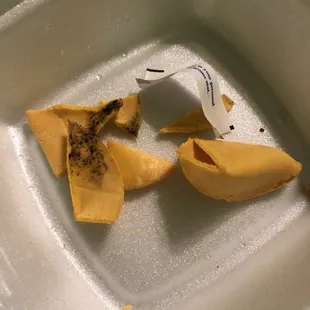 a broken piece of food on a plate