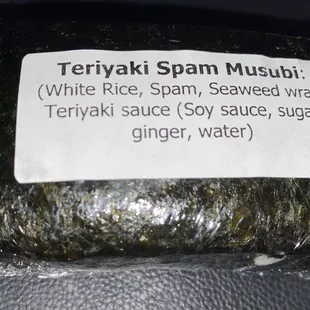 a wrap of rice, spam, seaweed, and ginger water