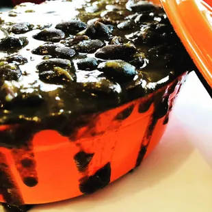 Savor the rich and complex flavors of Cuba in every spoonful of these traditional black beans, cooked to perfection.