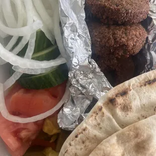 Ordered half dozen falafel and it came with 6 large pieces, pita bread, and garnish.