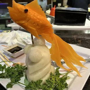 A fish made out of a carrot and radish - very cool!