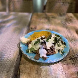 Dinner - 2/28/22 Greek Grotto/ Rice dish with Lamb , egg plant, titziki sauce.