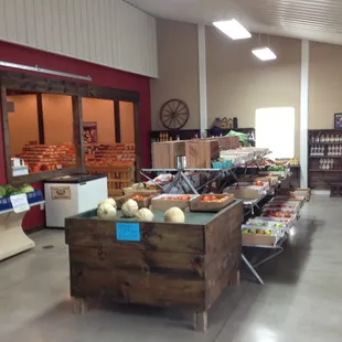 Main market area. Back corner are baked goods. Other side is the deli/ice cream area.Registers in the middle. Corn outside.