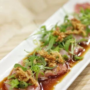 Toro tataki (tuna belly, ginger garlic soy, scallions, fried shallots)