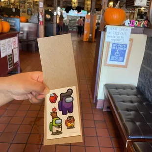 a hand holding a card