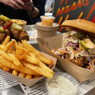 a chicken sandwich and fries on a table