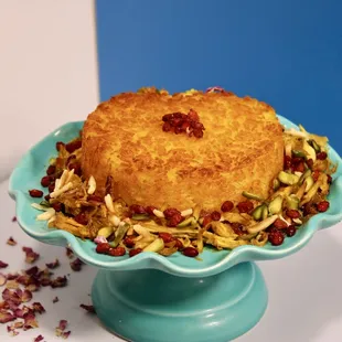a cake on a blue pedestal