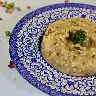 a blue and white plate of food