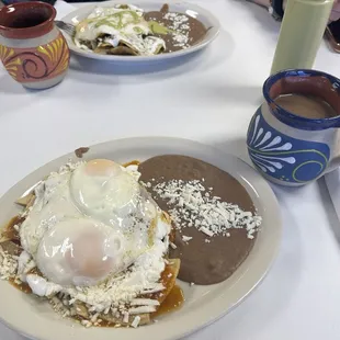 Chilaquiles Rojo con Huevo and Chilaquiles Verdes con Huevo with champurrado.