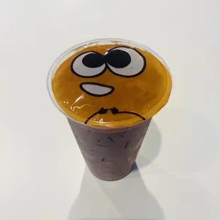 a plastic cup with a smiley face
