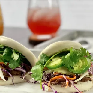Steam bao bun, pickled carrots, jalapeno, cucumber, purple cabbage served with our signature house sauce with grilled pork.