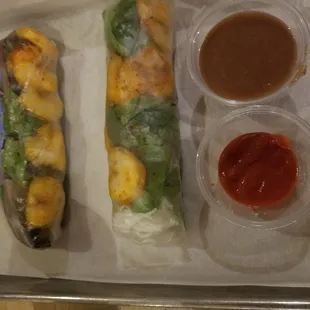 2 large fresh grilled shrimp spring rolls with delicious peanut sauce