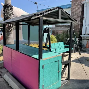 a pink and blue kiosk