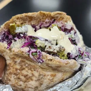 Falafel sandwich with added pickles.