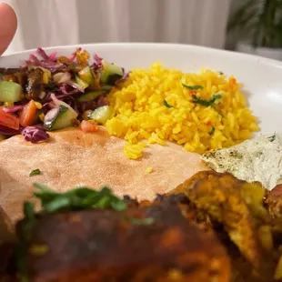 a person holding a plate of food