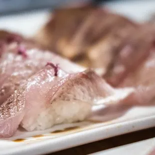 a close up of a plate of sushi