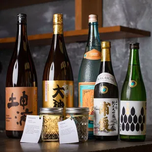 a variety of sake bottles