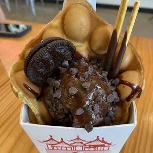 My wife&apos;s dark chocolate raspberry truffle ice cream with chocolate chips, an Oreo, and chocolate pocky sticks.