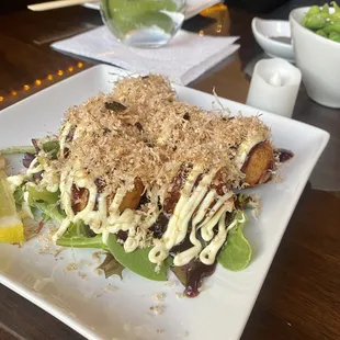 Takoyaki over salad. Delicious! And so soft inside.