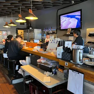 Ramen bar with the Warriors game playing